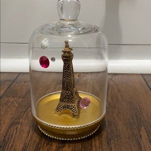 Gold Eiffel Tower in glass dome